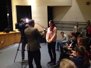 Reporter Tom Lewis from the local ABC news station interviews students before the Tinker Tour speech.