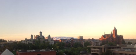 Syracuse University. The sunrise brings a glow to the Carrier Dome is in the background.