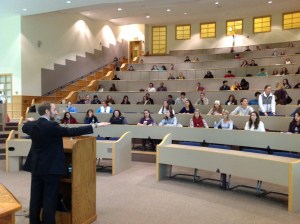 Patrick speaking at QU