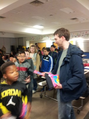 Lenny Tinker, Mary Beth's son, passes out coloring books